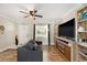 Inviting living room with modern decor, including a comfortable sofa and a decorative shelving unit at 917 2Nd Nw Ave, Largo, FL 33770