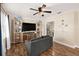 Warm and inviting living room featuring hardwood floors and a stylish entertainment center at 917 2Nd Nw Ave, Largo, FL 33770