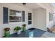 Inviting front porch with tasteful decorations, creating a warm and welcoming entrance at 917 2Nd Nw Ave, Largo, FL 33770