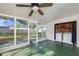 Enclosed sunroom with washer and dryer hookups, and view of the backyard at 917 2Nd Nw Ave, Largo, FL 33770