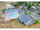 Community clubhouse and pool featuring multiple buildings, landscaping, and ample parking at 10711 Keys Gate Dr, Riverview, FL 33579