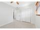 A light and airy bedroom features a spacious closet and neutral walls at 1095 Jackmar Rd, Dunedin, FL 34698