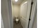 Toilet room features toilet, toilet paper holder, and light neutral paint at 11517 Timber Grove Ln, Brooksville, FL 34613