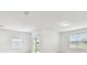 Bright and airy room with large windows, neutral walls, and plenty of natural light at 12823 Wanderlust Pl, Parrish, FL 34219
