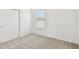 Cozy bedroom with plush carpeting and a closet with white doors at 12823 Wanderlust Pl, Parrish, FL 34219