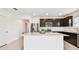 Modern kitchen featuring stainless steel appliances, a center island, and plenty of storage space at 12823 Wanderlust Pl, Parrish, FL 34219