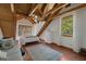 Bright bedroom with wood floors, a seating area, and an abundance of natural light at 14206 Walden Sheffield Rd, Dover, FL 33527
