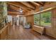 Spacious hallway with wooden floors, walls and ceiling, chair, and natural light at 14206 Walden Sheffield Rd, Dover, FL 33527