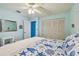 Bright bedroom with a seashell-themed comforter and an en-suite bathroom at 1601 43Rd N St # 140, St Petersburg, FL 33713