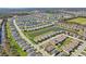 Scenic aerial view of a neighborhood featuring manicured lawns and several ponds at 1848 Sunset Preserve Way, Port Charlotte, FL 33953