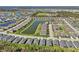 An aerial view of a meticulously planned community, highlighting water features at 1848 Sunset Preserve Way, Port Charlotte, FL 33953