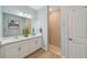 Bright bathroom with a double sink vanity and a glass-enclosed walk-in shower at 1848 Sunset Preserve Way, Port Charlotte, FL 33953