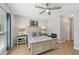 Inviting bedroom highlighting wood-look flooring and lots of natural light at 1848 Sunset Preserve Way, Port Charlotte, FL 33953