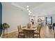 Bright dining area with a view of the kitchen and adjacent living spaces at 1848 Sunset Preserve Way, Port Charlotte, FL 33953