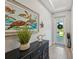Bright entryway featuring a turtle-themed art and stylish decor at 1848 Sunset Preserve Way, Port Charlotte, FL 33953