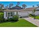 Beautiful home with a well manicured lawn and clean front exterior at 1848 Sunset Preserve Way, Port Charlotte, FL 33953