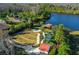 Overhead view of the community park, pier on the lake, playground, and walking path at 19122 Sunset Bay Dr, Land O Lakes, FL 34638