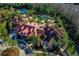 Stunning aerial view of the community center with pools and lush landscaping at 19122 Sunset Bay Dr, Land O Lakes, FL 34638
