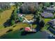 Aerial view of the lakefront park featuring a playground, pier, and scenic walking paths at 19122 Sunset Bay Dr, Land O Lakes, FL 34638