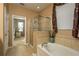 Relaxing soaking tub and tiled shower combo is the perfect owners' retreat at 19122 Sunset Bay Dr, Land O Lakes, FL 34638