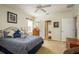 Bedroom with carpet, bed, closet doors, and side door at 19122 Sunset Bay Dr, Land O Lakes, FL 34638