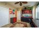 Well-lit bedroom with hutch and desk, closet, and colorful accents for a modern look at 19122 Sunset Bay Dr, Land O Lakes, FL 34638