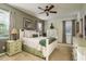 Cozy bedroom with neutral tones, a ceiling fan, and lots of natural light at 19122 Sunset Bay Dr, Land O Lakes, FL 34638