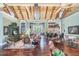 Open clubhouse area featuring lounge seating, dining tables, and a bar area, perfect for socializing and community events at 19122 Sunset Bay Dr, Land O Lakes, FL 34638