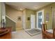 Bright entryway with tile flooring, staircase, and doorways leading to other rooms at 19122 Sunset Bay Dr, Land O Lakes, FL 34638
