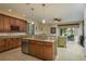 Spacious kitchen features granite countertops, wooden cabinetry, and stainless steel appliances at 19122 Sunset Bay Dr, Land O Lakes, FL 34638