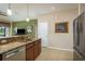 Kitchen featuring granite countertops, a breakfast bar, stainless steel appliances, and an open layout at 19122 Sunset Bay Dr, Land O Lakes, FL 34638
