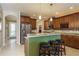 Kitchen with granite countertops, dark wood cabinets, and stainless steel appliances at 19122 Sunset Bay Dr, Land O Lakes, FL 34638