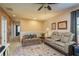 Upstairs living room with ceiling fan and neutral walls at 19122 Sunset Bay Dr, Land O Lakes, FL 34638