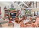 Inviting lounge area with comfortable seating, a large TV, and bar seating for relaxing and socializing at 19122 Sunset Bay Dr, Land O Lakes, FL 34638