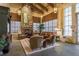 Cozy lounge area with stone fireplace, comfortable seating, and natural light, ideal for relaxation and social gatherings at 19122 Sunset Bay Dr, Land O Lakes, FL 34638