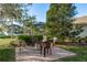 Charming brick patio is perfect for outdoor gatherings and relaxation in a landscaped backyard at 19122 Sunset Bay Dr, Land O Lakes, FL 34638
