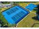 Aerial view of the well-maintained community tennis and basketball courts at 19122 Sunset Bay Dr, Land O Lakes, FL 34638