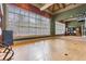 Serene yoga studio with hardwood floors, mirrored wall, and fitness equipment, ideal for exercise and relaxation at 19122 Sunset Bay Dr, Land O Lakes, FL 34638