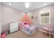 Charming bedroom featuring a playful design with a princess theme and modern furnishings at 19563 Roseate Dr, Lutz, FL 33558