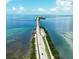 Aerial view of coastal bridge over clear ocean water on a clear sunny day at 219 S Betty Ln, Clearwater, FL 33756