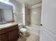 Standard bathroom features a shower-tub combo, vanity and tile floors at 2807 Lantern Hill Ave, Brandon, FL 33511