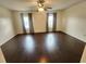 Spacious bedroom with hardwood floors, ceiling fan and two windows at 2807 Lantern Hill Ave, Brandon, FL 33511