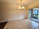 Bright dining area with tile floors and a sliding glass door to the outdoor space at 2807 Lantern Hill Ave, Brandon, FL 33511