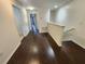 Hallway with wood floors leading to bedrooms at 2807 Lantern Hill Ave, Brandon, FL 33511