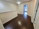 Bright hallway features hardwood floors and neutral paint throughout at 2807 Lantern Hill Ave, Brandon, FL 33511