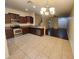 Open kitchen with stainless steel appliances, granite countertops, and a view into the living area at 2807 Lantern Hill Ave, Brandon, FL 33511