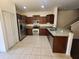 Spacious kitchen featuring stainless steel appliances, granite countertops, and ample cabinet space at 2807 Lantern Hill Ave, Brandon, FL 33511