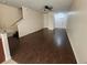Bright living room with a ceiling fan and a staircase leading to the upper level at 2807 Lantern Hill Ave, Brandon, FL 33511