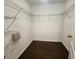 Walk-in closet with wood floor and wire shelving at 2807 Lantern Hill Ave, Brandon, FL 33511