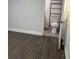 This bathroom features tiled floors, a functional toilet, and a practical shelving unit for storage at 2912 E North St, Tampa, FL 33610